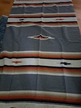 heavyweight Mexican diamond center blanket in a charcoal gray colorway.Design &
